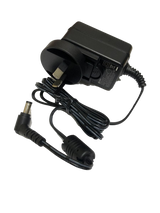 Black power adapter with plug and cable on a clear background