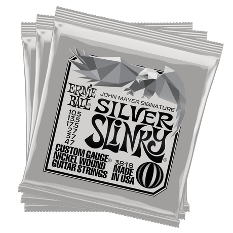 3-pack of Ernie Ball John Mayer Silver Slinky Signature electric guitar strings displayed